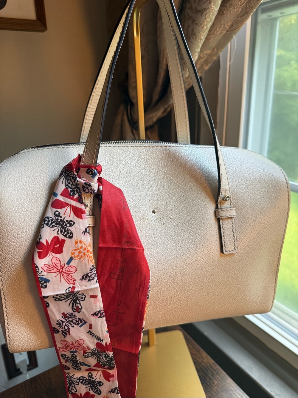 Kate Spade cream satchel with red and multicolor scarf tie. Very Good Condition